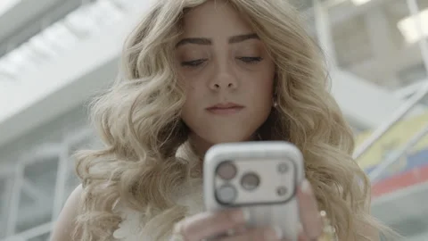 CU of a young woman text on an iPhone indoors, Provo, Utah Stock Footage 338202802
