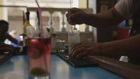 CUBA Bartender Makes Red Cocktail on Bar, 4K Stock Footage 127056532