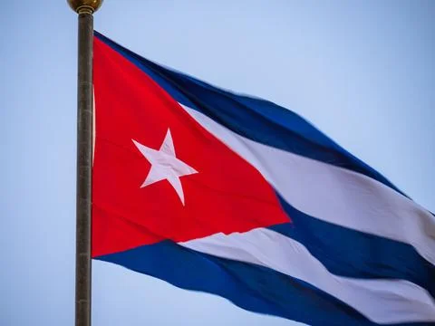 Cuba Flag blowing in the wind with a blue sky background Stock Photos