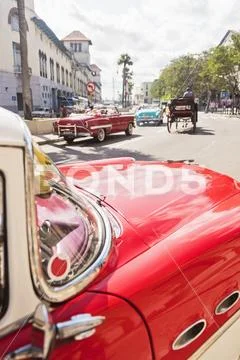 Cuba, Havana, Red vintage car in street Stock Photos