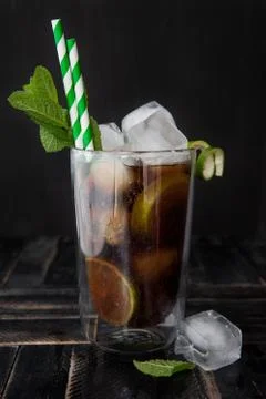 Cuba Libre Longdrink on ice Stock Photos