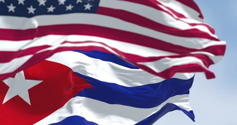 Cuba national flags waving in the wind on a clear day Stock Footage 337651335
