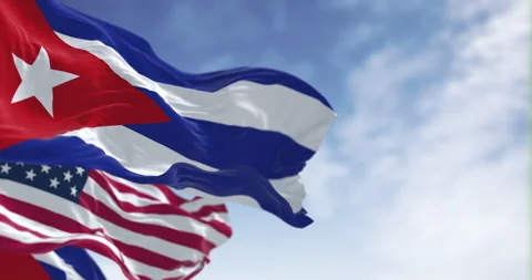 Cuba national flags waving in the wind on a clear day Stock Footage 339061532