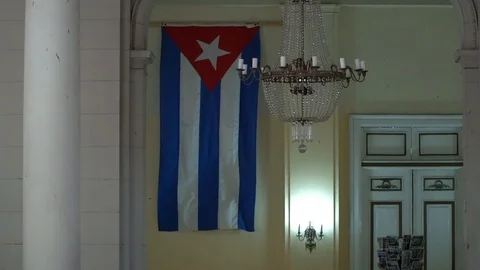 Cuban flag waves inside building Stock Footage 111581237