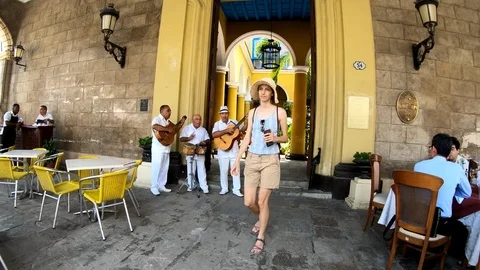 Cuban men playing instruments in a band 스톡 동영상 90974407