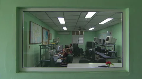 Cuban weather forecasters at computers Stock Footage 39992933