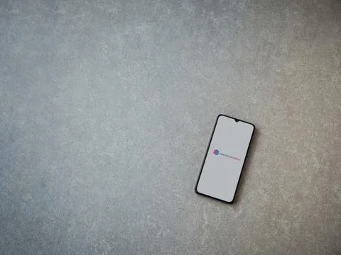 Cube ACR app launch screen with logo on the display of a black mobile smartph Stock Photos