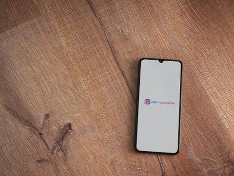 Cube ACR app launch screen with logo on the display of a black mobile smartph Stock Photos