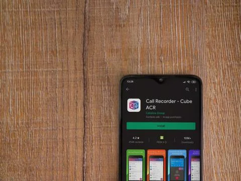 Cube ACR app play store page on the display of a black mobile smartphone on w Foto stock