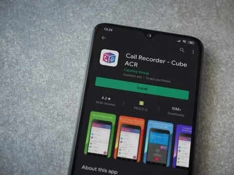 Cube ACR app play store page on the display of a black mobile smartphone on c Stock Photos