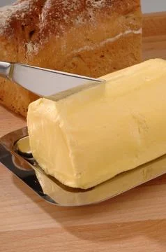 Cube of butter, bread knife Foto stock