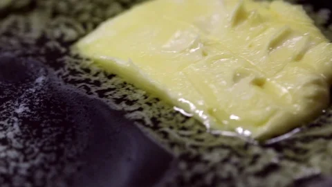 Cube of butter melting Stock Footage 70759630
