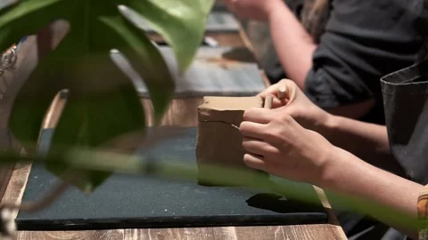 Cube of clay becomes a ceramic bowl in clay workshop Stock Footage 201568397