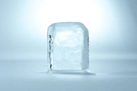 Cube of clear ice on light blue background Stockfoto's