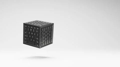 Cube Computer Keyboard Spinning on Studio Light Gray Background Stock Footage 227513843