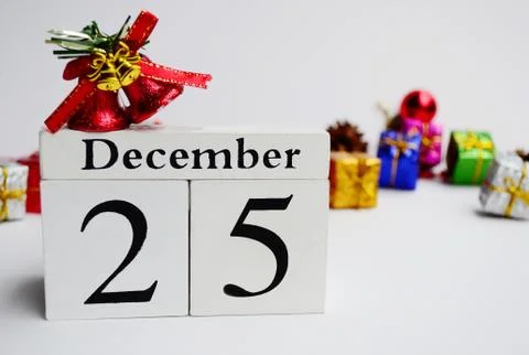 Cube Date 25th December with blurred christmas ornament background Stock Photos