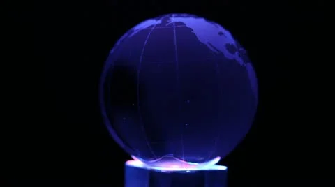 Cube emits color light and sphere with world map on it spin Stock Footage 10852609