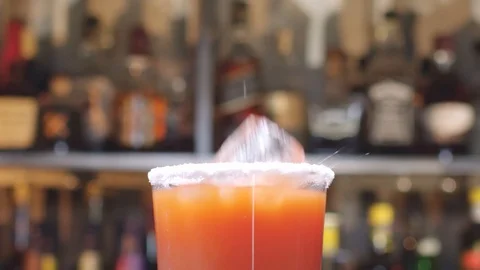 Cube of ice into a glass Stock Footage 129084584