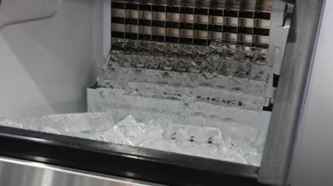 Cube ice in ice making machine Stock Photos