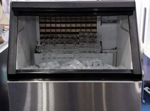 Cube ice in ice making machine Stock Photos