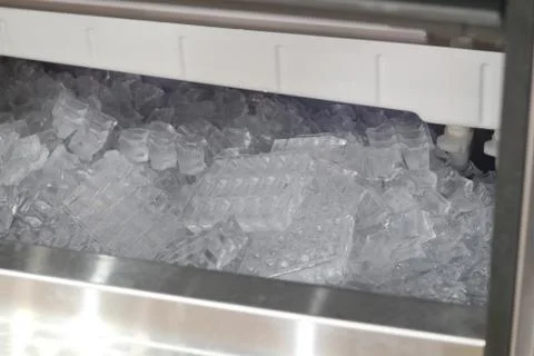 The cube ice in ice making machine Stock Photos