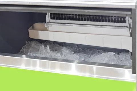 The cube ice in ice making machine Stock Photos