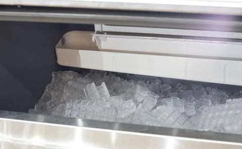 The cube ice in ice making machine Stock Photos