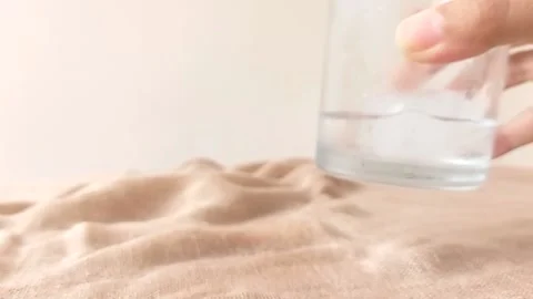 A cube of ice on a small glass Stock Footage 146249707