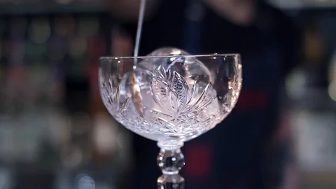 Cube of ice in a transparent glass Stock Footage 129088375
