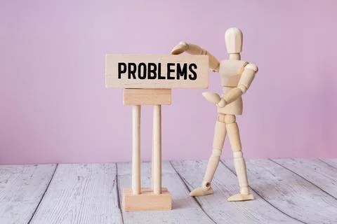 Cube with question mark on wooden background. Stock Photos