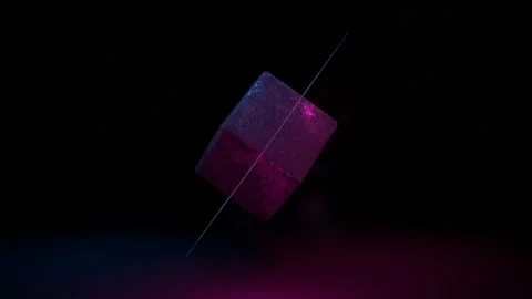 Cube with rough texture with cubic glowing frames around spinning on dark backgr Video stock 309224578