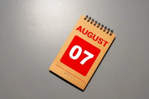 Cube shape calendar for August 07 on wooden surface Stock Photos