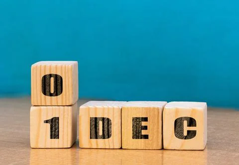 Cube shape calendar for December 01 on wooden surface with empty space Stock Photos