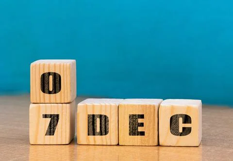 Cube shape calendar for December 07 on wooden surface with empty space Stock Photos