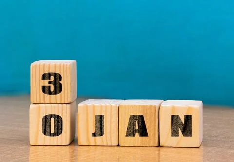 Cube shape calendar for January 30 on wooden surface with empty space Stock Photos