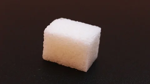 A cube of sugar close up Stock Footage 106068521