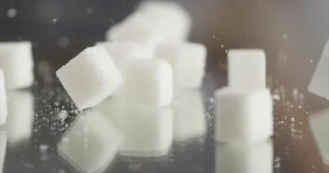 Cube sugar falls on a mirror surface Stock Footage 198701593