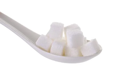Cube sugars in teaspoon isolated on white background Stock Photos