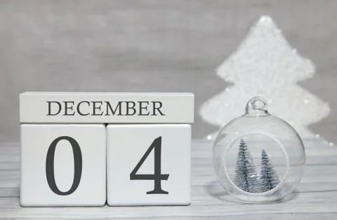Cube with text from numbers and a month, December 4, the end of the year and  写真素材