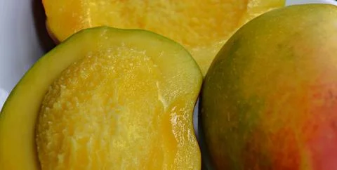 Cubed mango background, close-up, mango background, top view Stock Photos