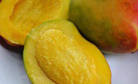 Cubed mango background, close-up, mango background, top view Stock Photos