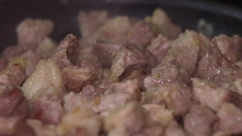 Cubed Raw Beef Cooking in a Pan Video stock 336239896