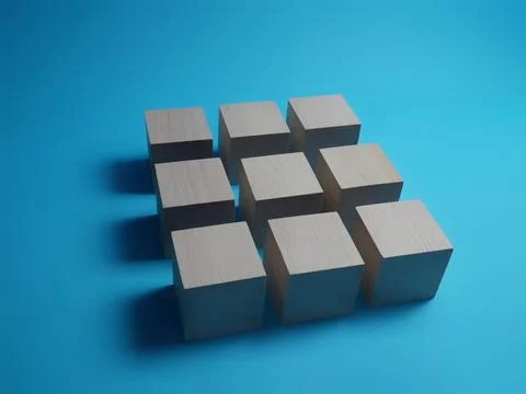 Cubes arranged in a square shape on a blue background Stock Photos