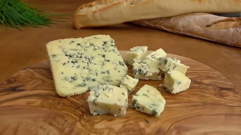 Cubes of blue Roquefort cheese. Circular movement of camera Stock Footage 309458866