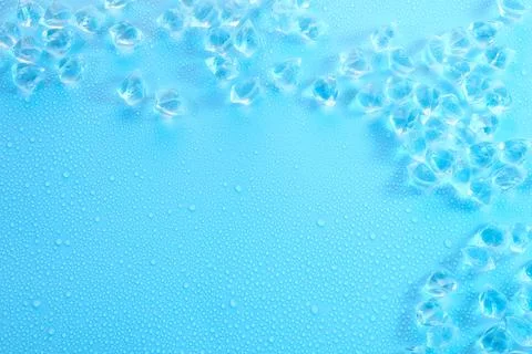 Cubes of clear ice on light blue background, flat lay. Space for text 스톡 사진