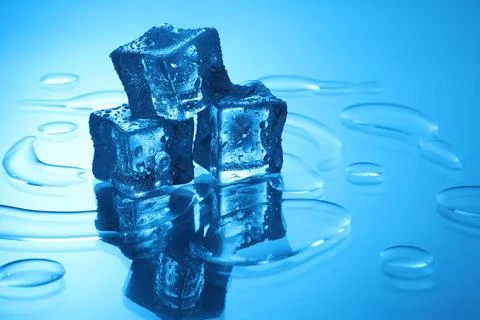 Cubes of clear ice on light blue background, space for text 스톡 사진