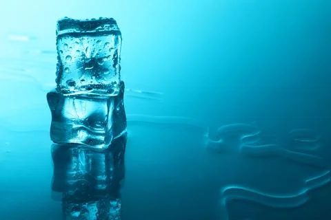 Cubes of clear ice on light blue background, space for text Stock Photos