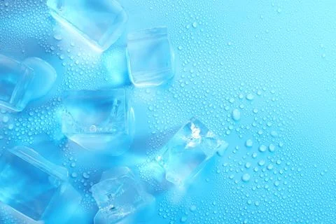 Cubes of clear ice on light blue background, flat lay. Space for text Stock Photos