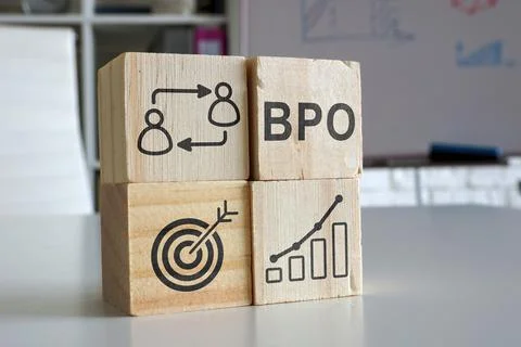Cubes with diagrams symbolizing BPO business process outsourcing. Stock Photos