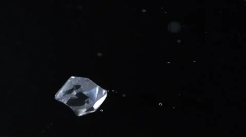 Cubes falling and bouncing on puddle, Slow Motion Stock Footage 31819556